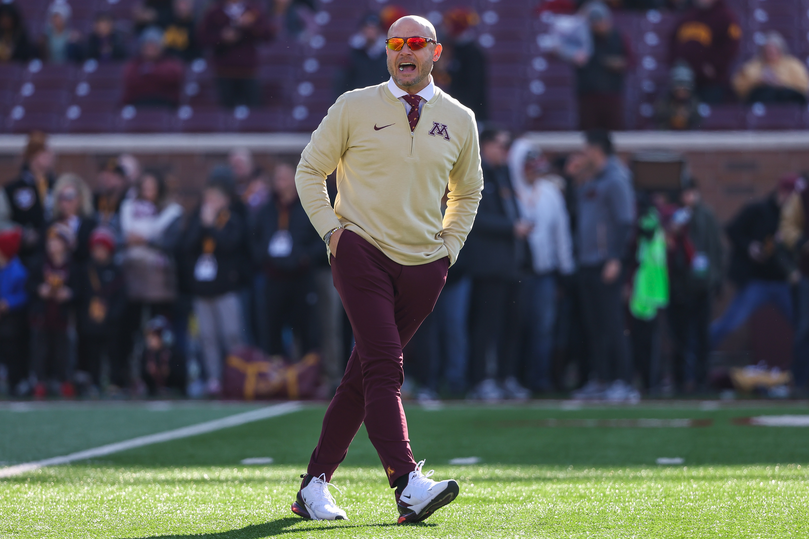 P.J. Fleck looks on